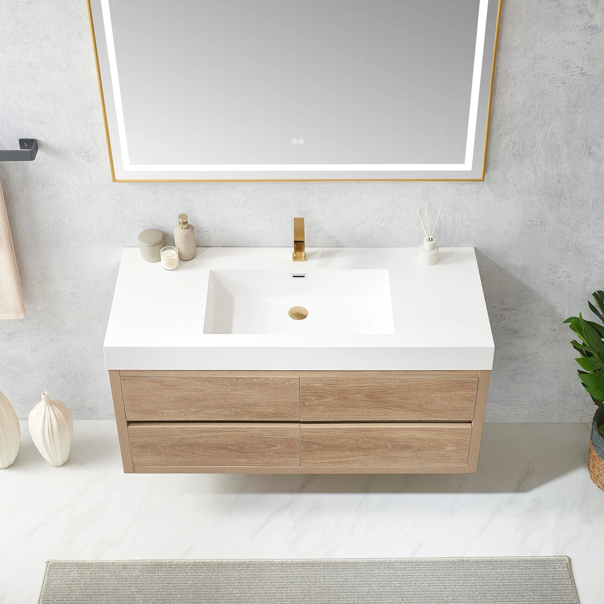 Detail of the integrated sink top and cabinet front on the 48 inch wall-mount vanity