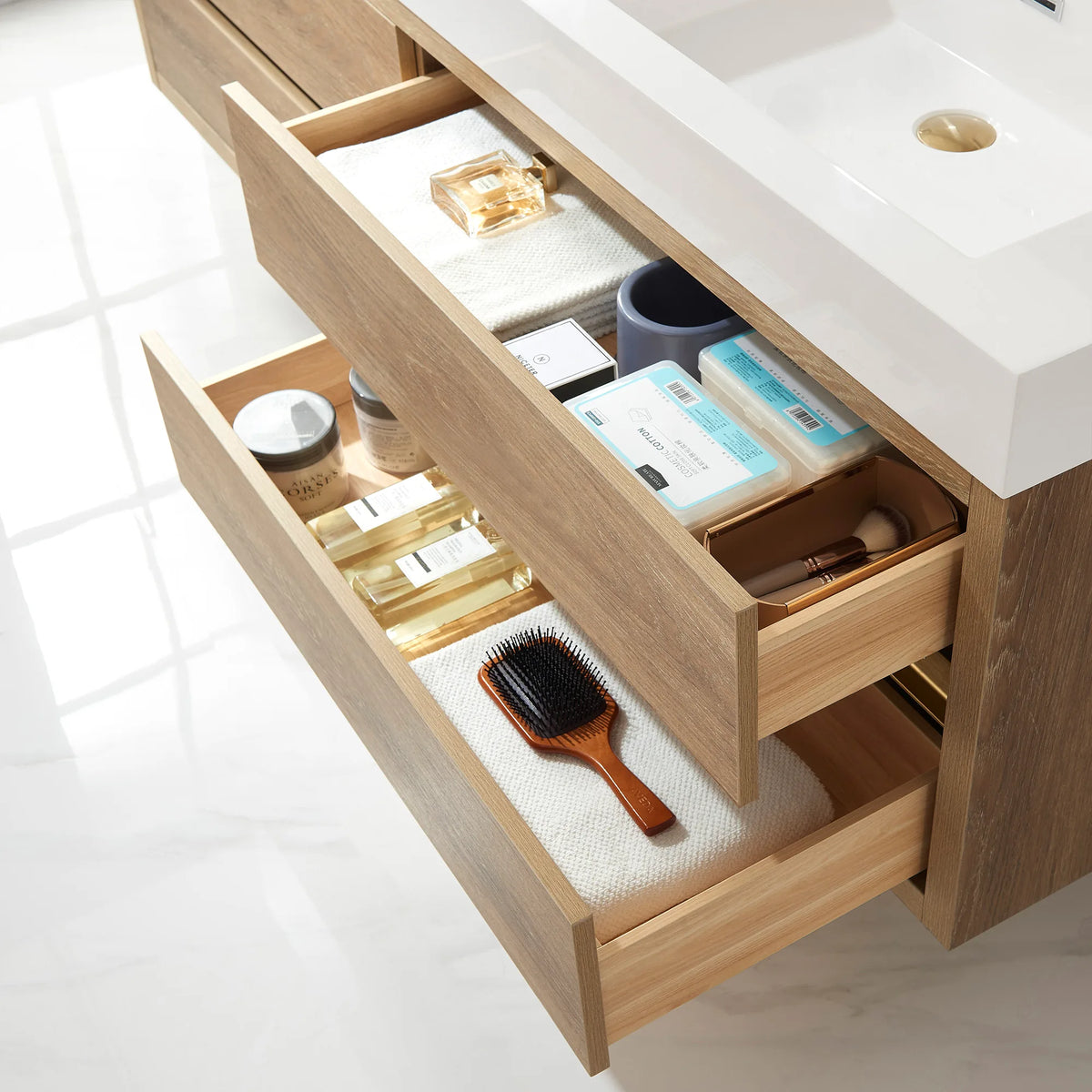 Looking into open drawers on the North American Oak cabinet, white sink top overhead