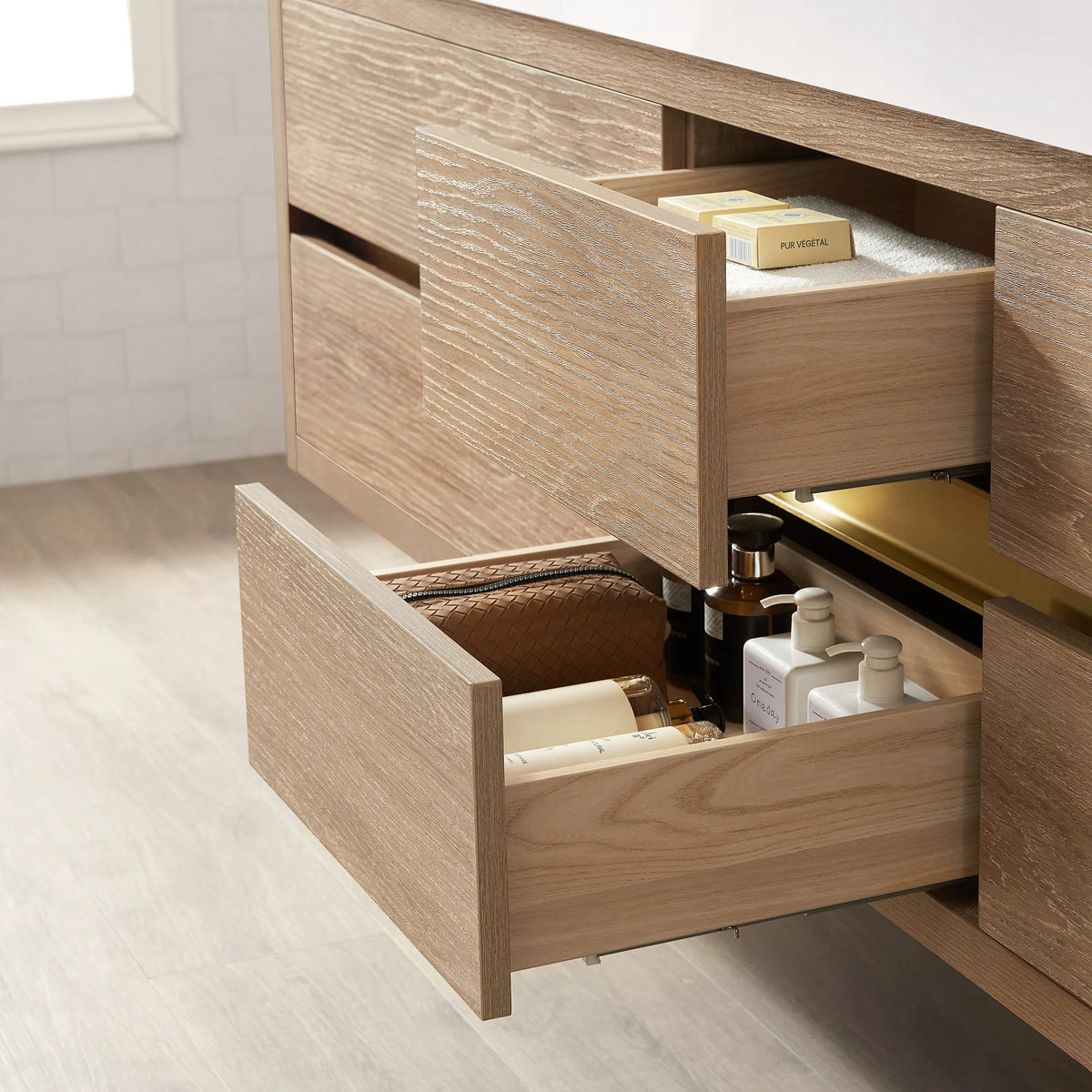 Inside an open drawer on the North American Oak cabinet, with jars and bottles and a second drawer below