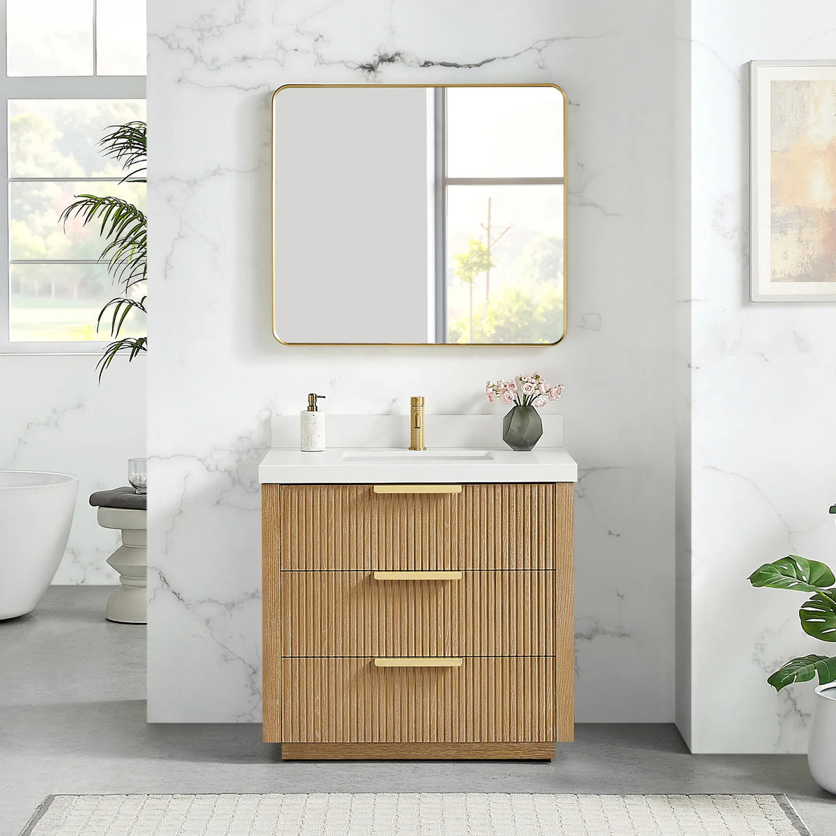 Brushed gold wall mirror above the 36 inch Washed Ash Grey single vanity, quartz top and three drawers