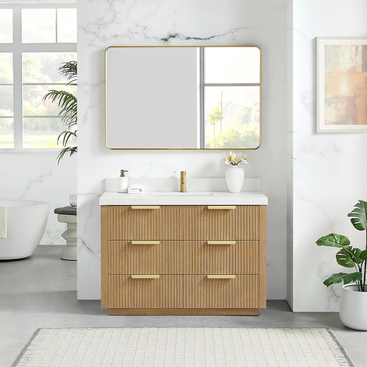 Brushed gold wall mirror above the 48 inch Washed Ash Grey single vanity, quartz top and six drawers