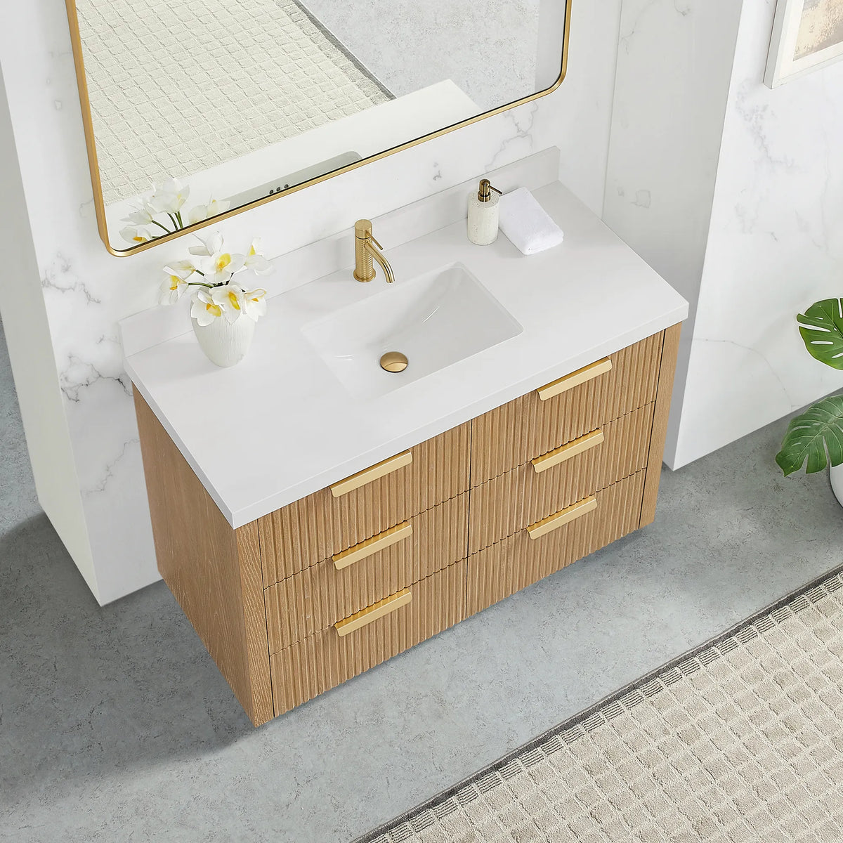 Washed Ash Grey vanity, 48 inch, seen from a high corner with brushed gold handles below a pure white quartz top