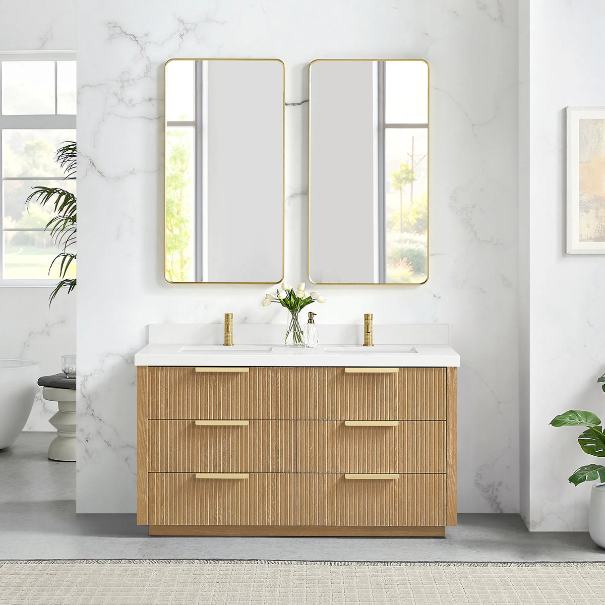 Two brushed gold wall mirrors above the 60 inch Washed Ash Grey double vanity, quartz top and six drawers