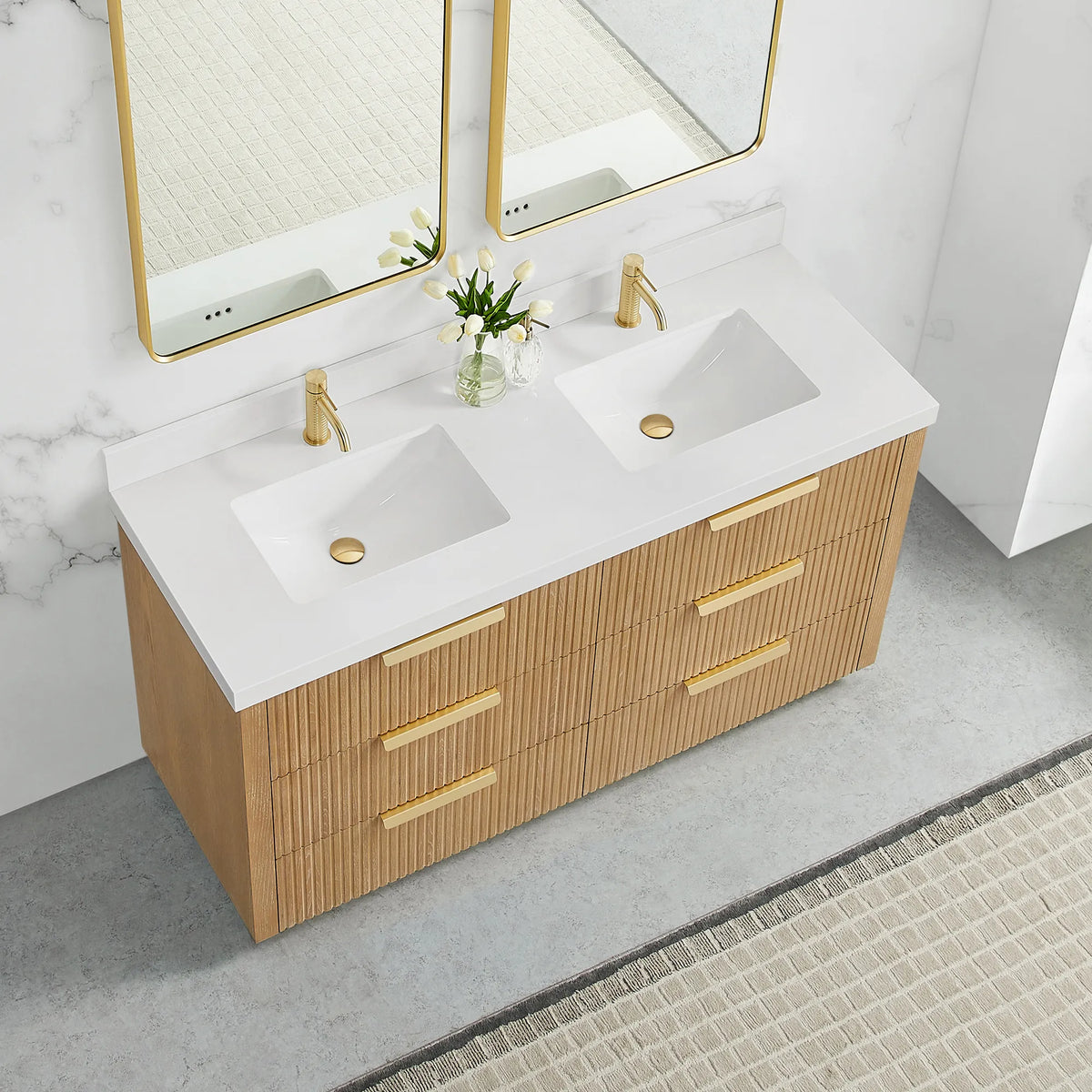 Washed Ash Grey vanity, 60 inch, seen from a high corner with brushed gold handles below a pure white quartz top