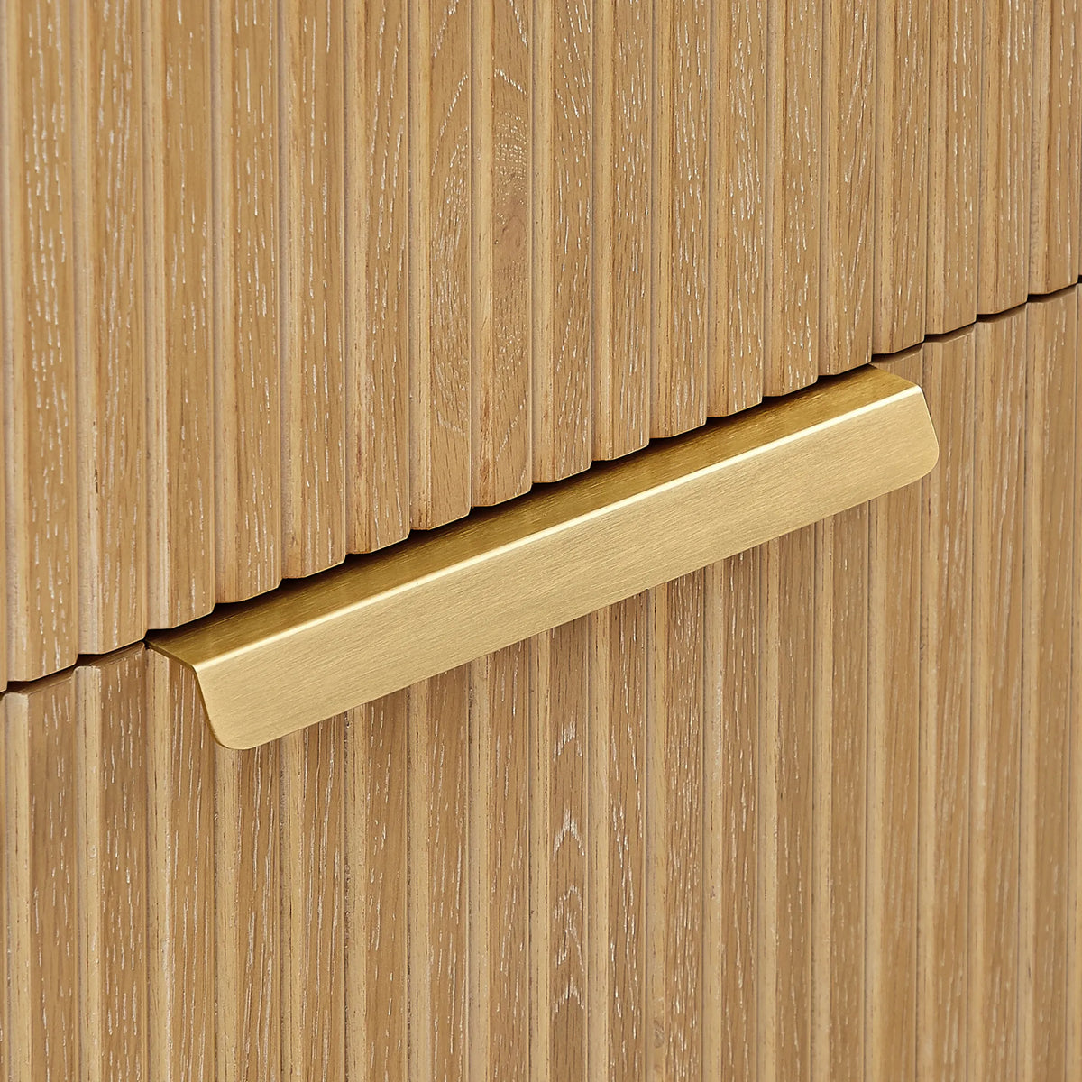 Detail of the grooved Washed Ash Grey panel and brushed gold handle on the 60 inch vanity