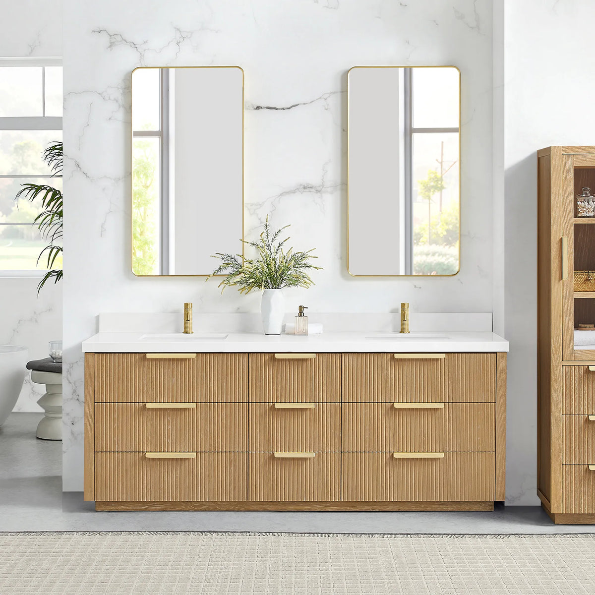 Two brushed gold wall mirrors above the 84 inch Washed Ash Grey double vanity, quartz top and nine drawers