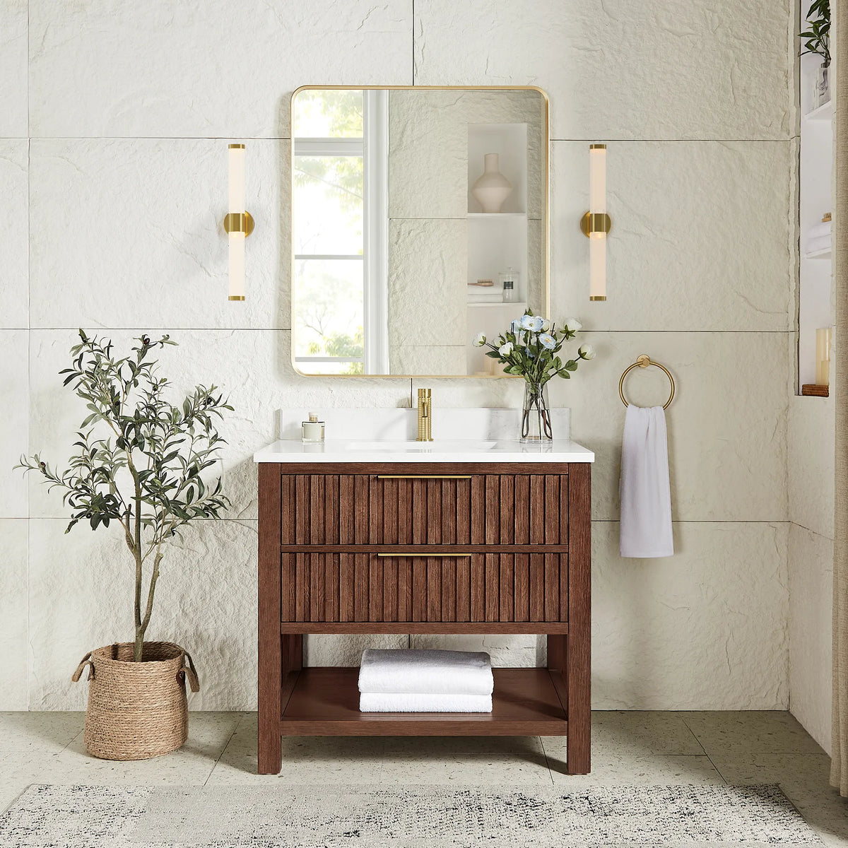Matching rectangular mirror in a gold frame hung over the 36-inch Aged Dark Brown Oak cabinet