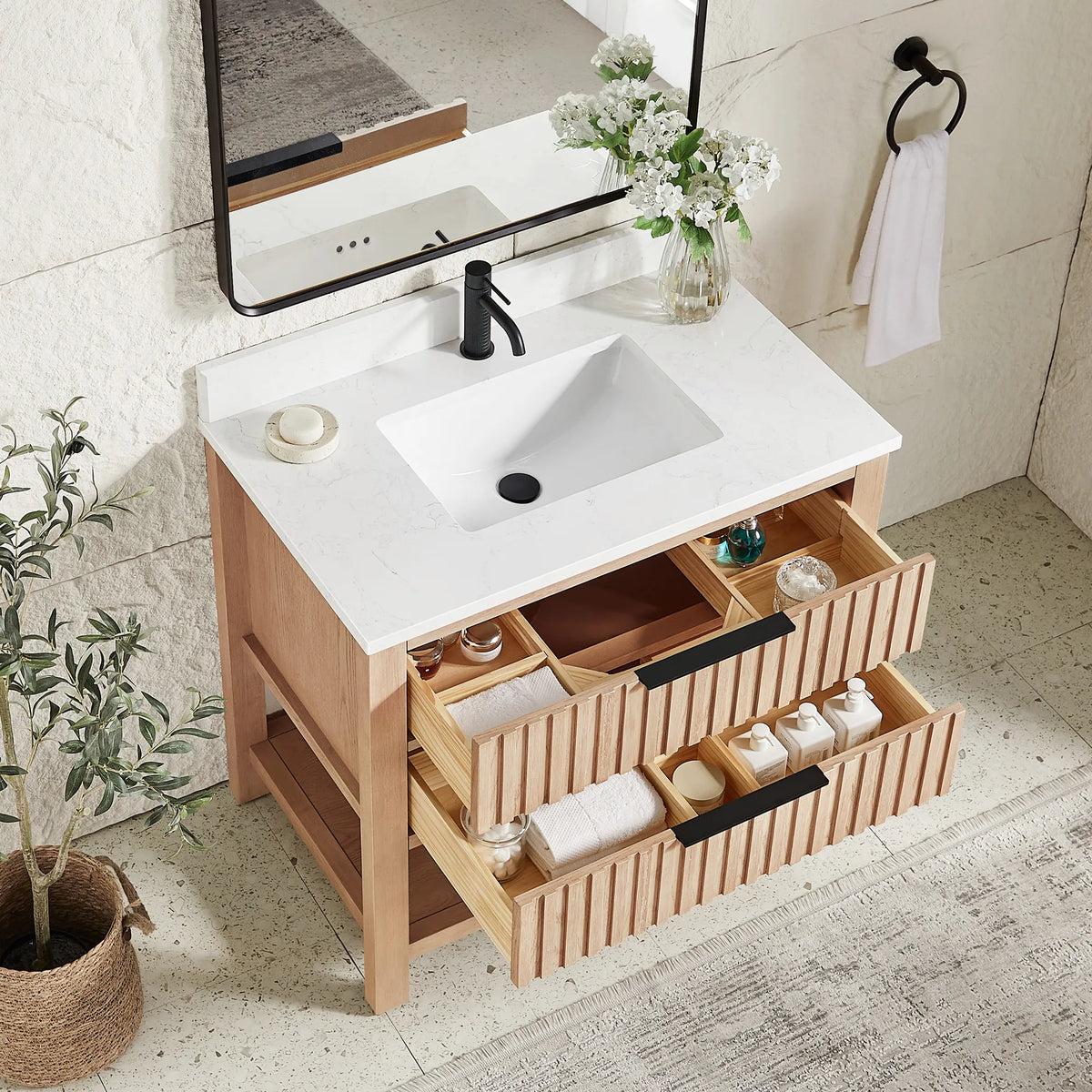 Inside storage in a staged room: drawers pulled open on the 36-inch Aged Natural Oak cabinet