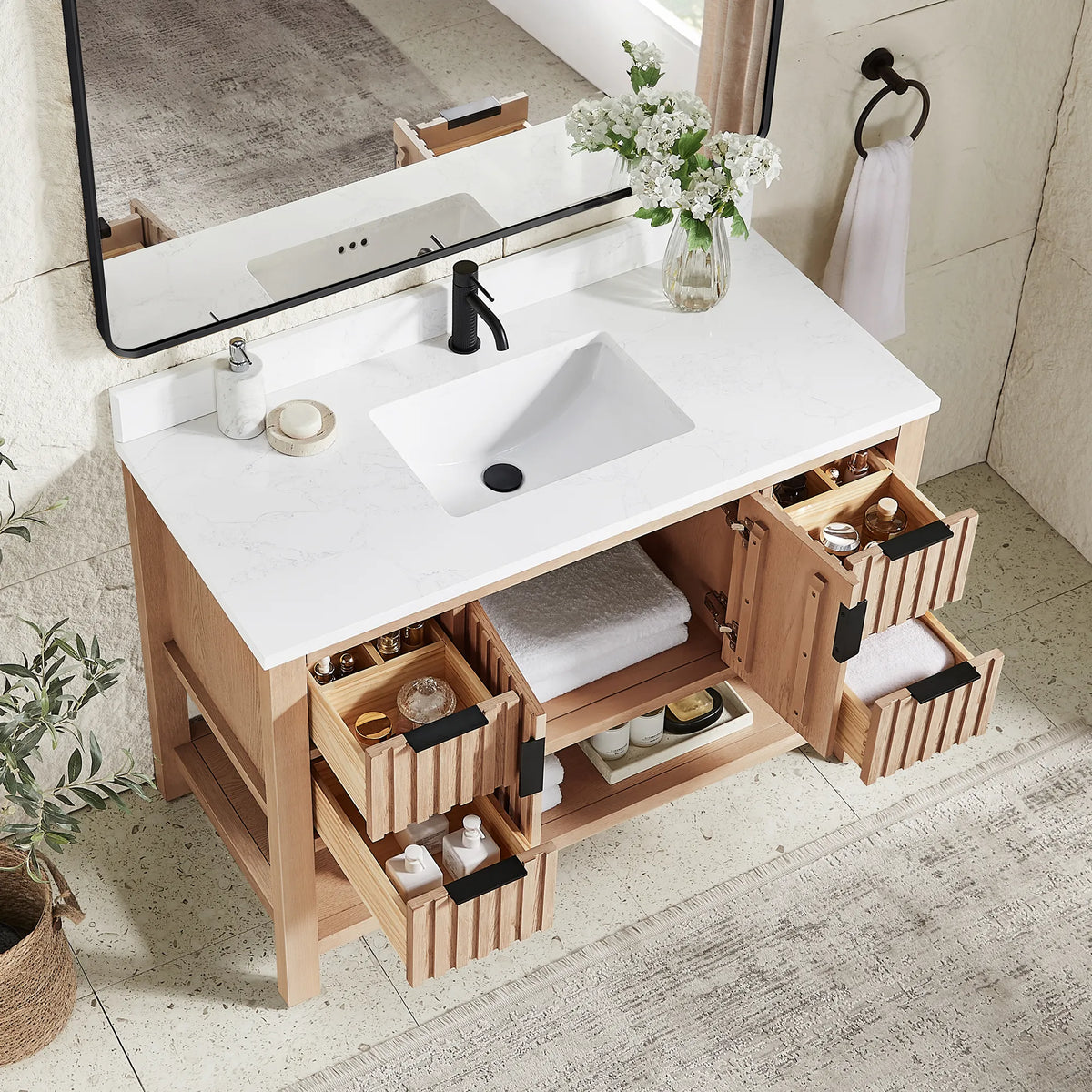 Inside storage in a staged room: doors and drawers open on the 48-inch Aged Natural Oak cabinet