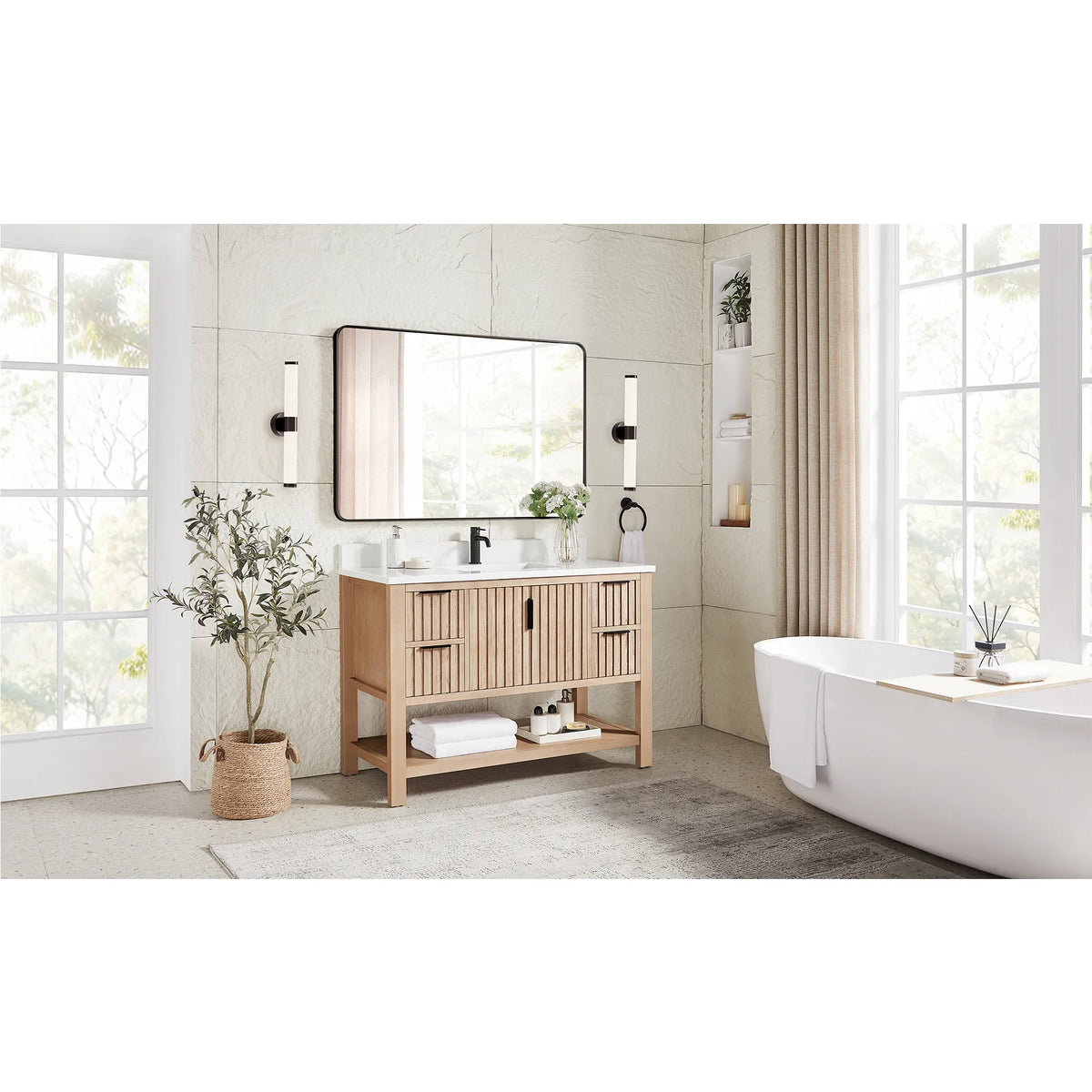 Wide room shot with a tub and window light behind the 48-inch Aged Natural Oak vanity