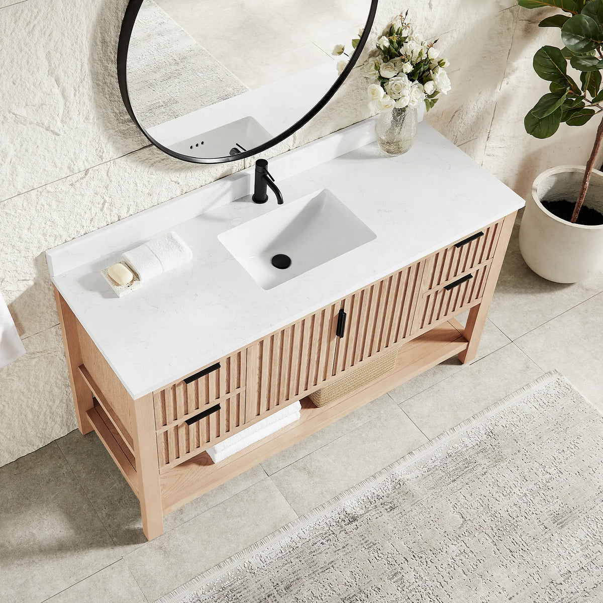 Top-down angle: a stone-composite top and ceramic undermount basin on the 60-inch Aged Natural Oak cabinet