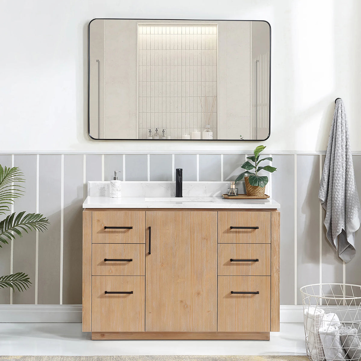 Bathroom scene with a 48 inch Fir Wood Brown vanity, a rectangular framed mirror, plant and wire basket