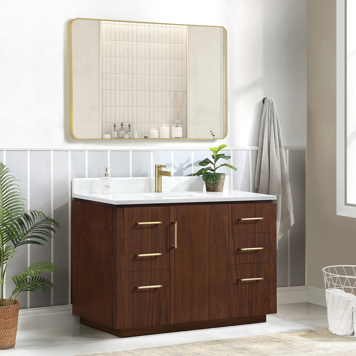 Three-quarter room shot of the 48 inch vanity, with a soap dispenser and a plant on the stone top