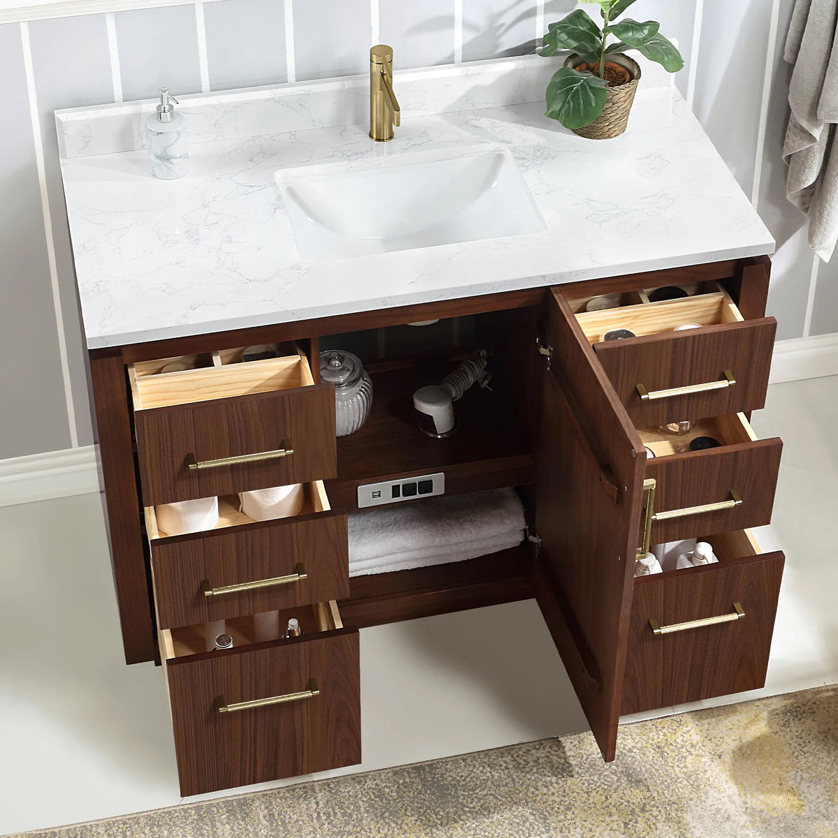 Interior view of the vanity with drawers and door open, towels and toiletries visible