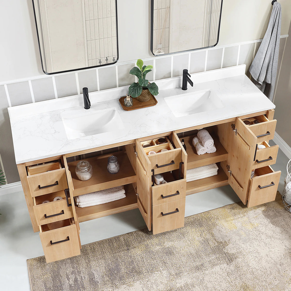 Overhead angle of the 84 inch double vanity with drawers and doors open, towels and jars inside
