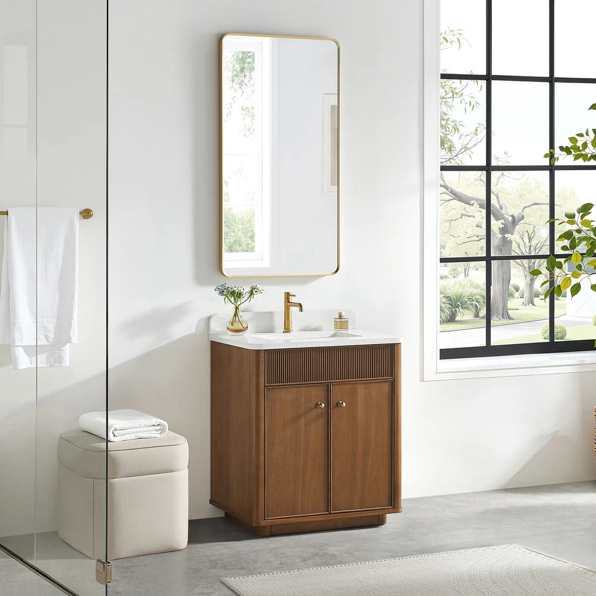 30 inch vanity in Natural Walnut with a gold-framed mirror above and a cream stool on a gray floor