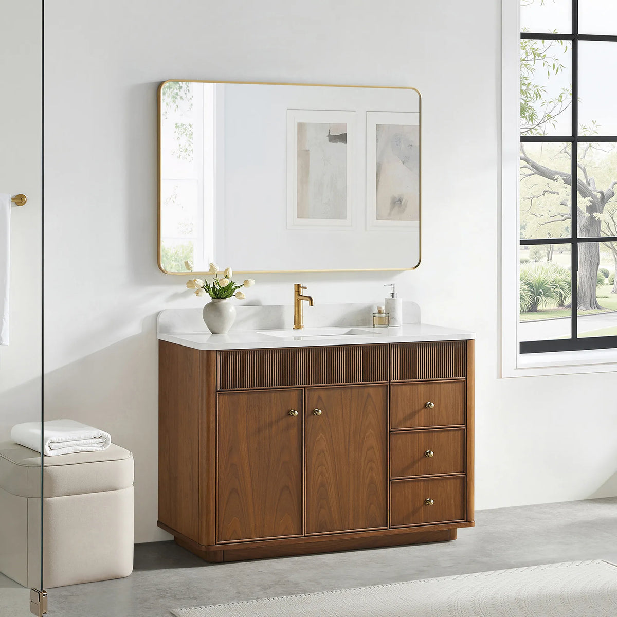 48 inch vanity in Natural Walnut with a gold-framed mirror above and a cream stool on a gray floor