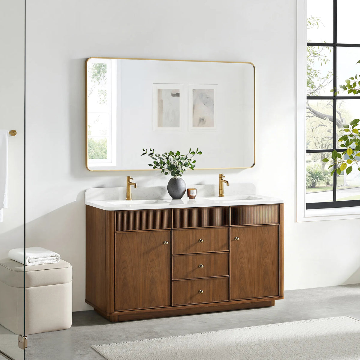 60 inch vanity in Natural Walnut with a gold-framed mirror above and a cream stool on a gray floor