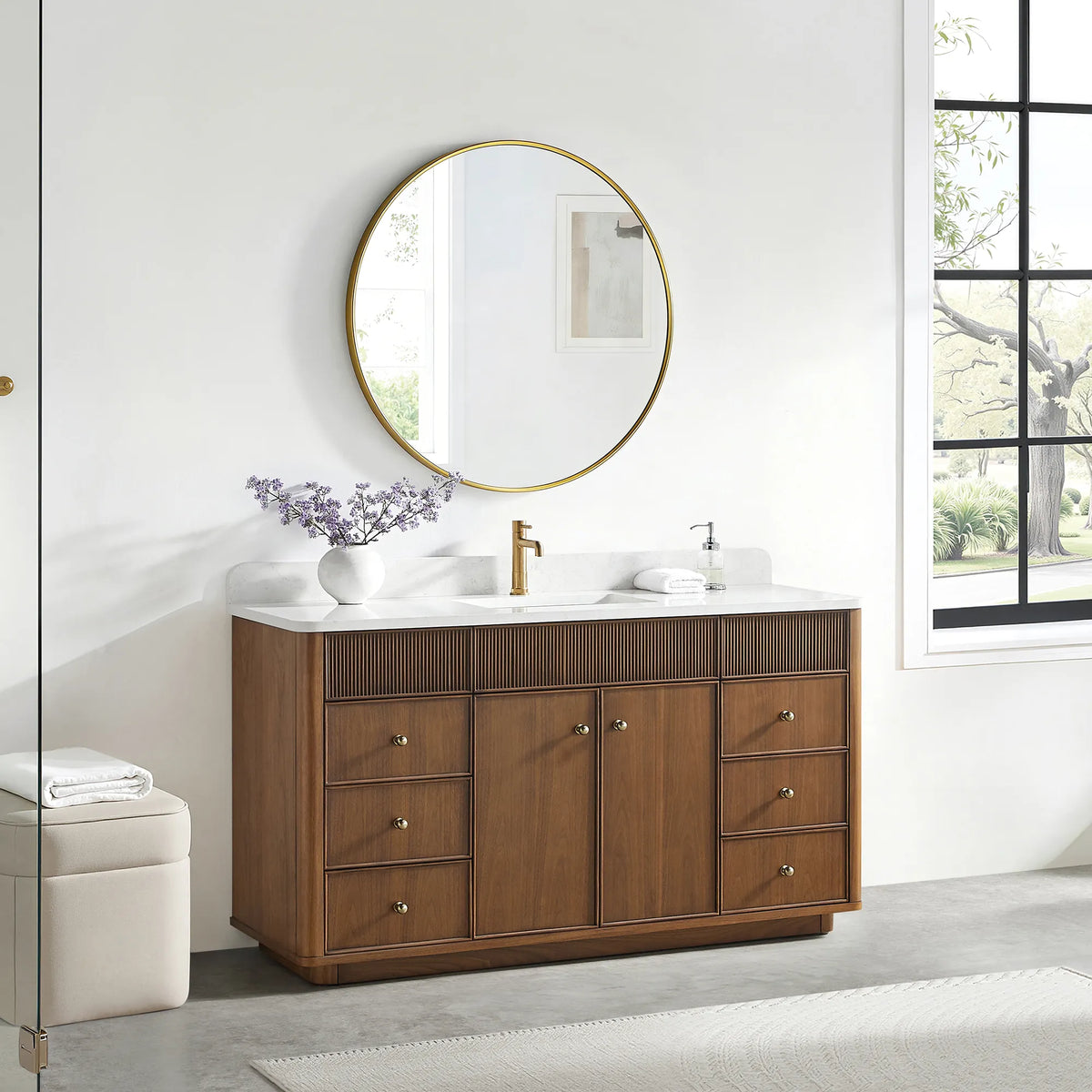 60 inch vanity in Natural Walnut with a gold-framed mirror above and a cream stool on a gray floor
