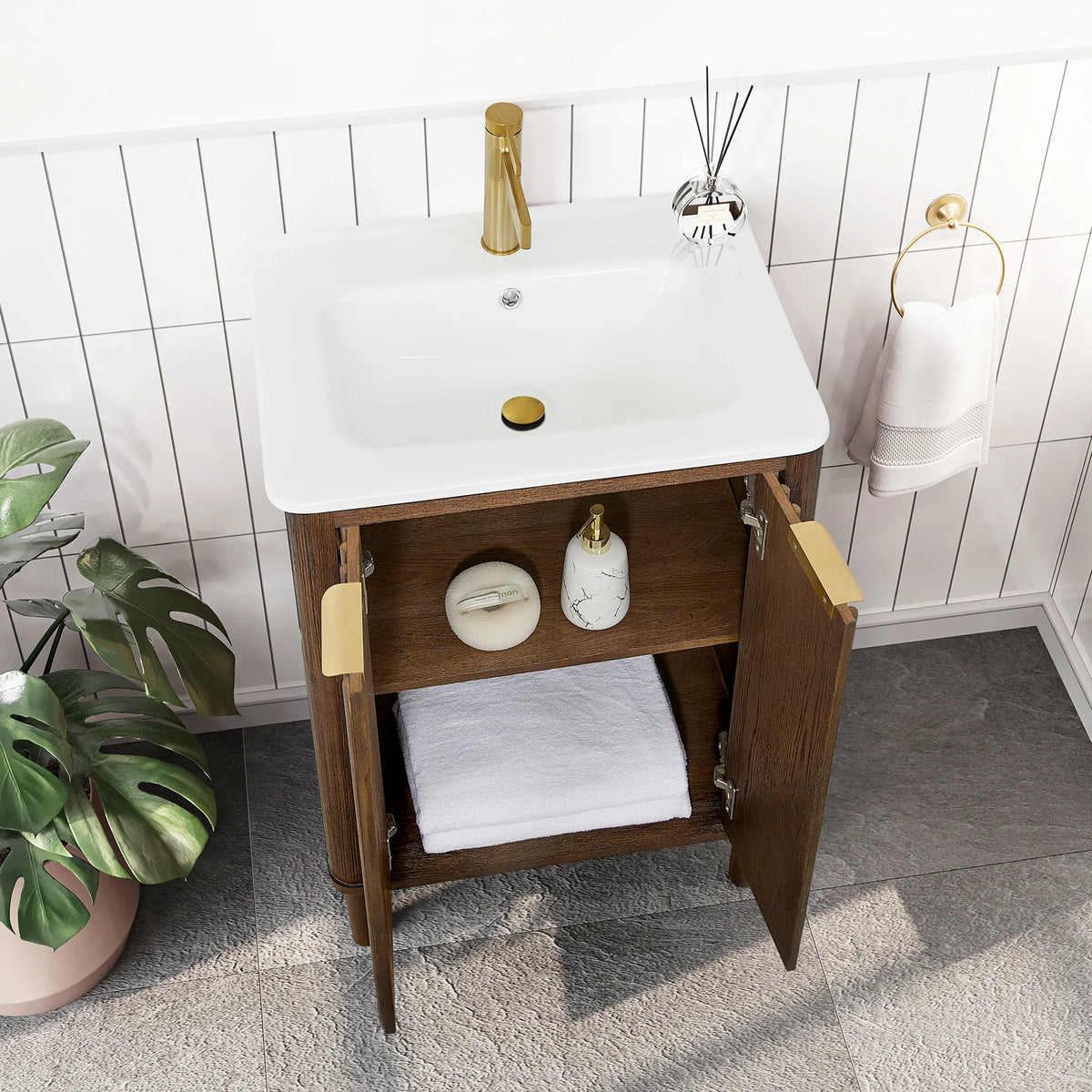 Open cabinet of the 24-inch single vanity, a soap pump and a dish on the middle shelf