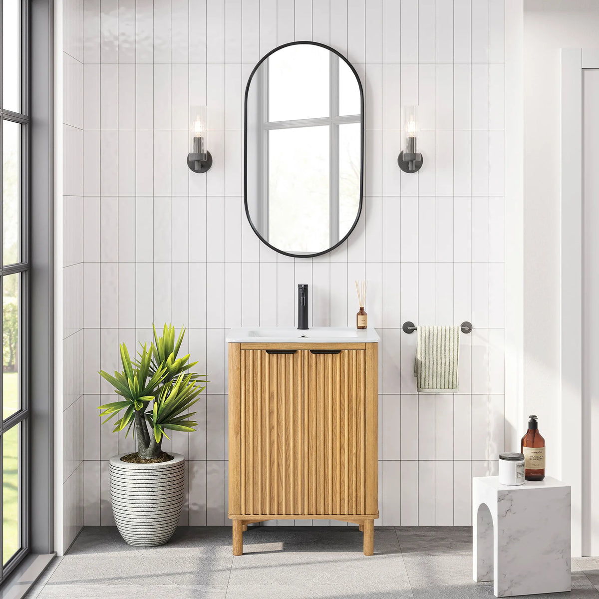 Bathroom scene for the 24-inch vanity and its matching mirror, with white tile, a white stool and a towel bar