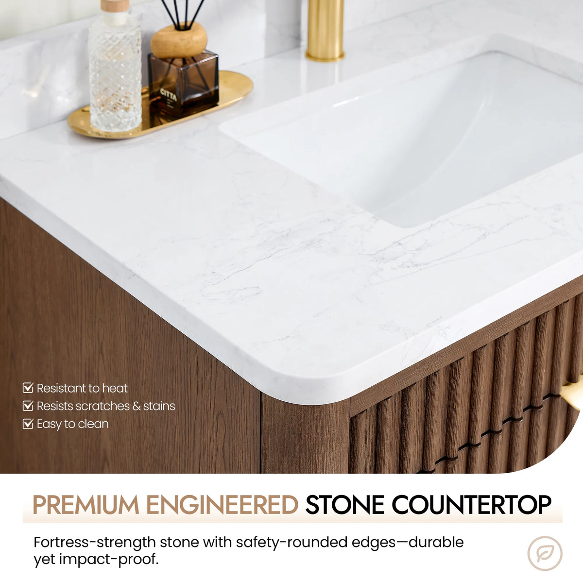 Close view of the countertop's safety-rounded corner and an undermount basin, with a tray of bottles