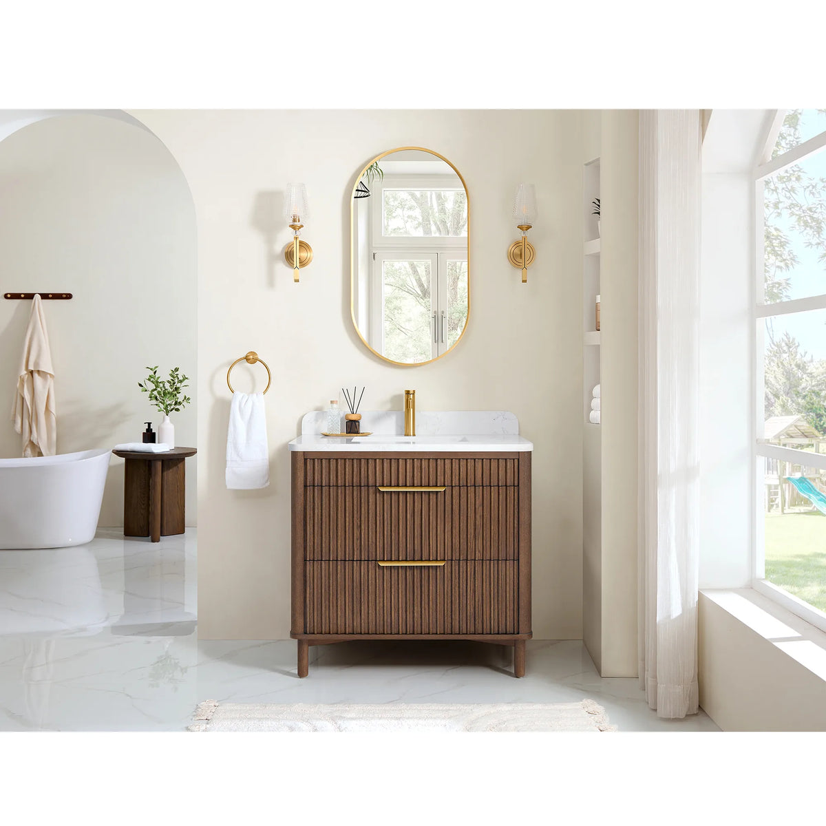 Wide room view of the 36-inch two-drawer vanity beside a freestanding tub, with a large window at right