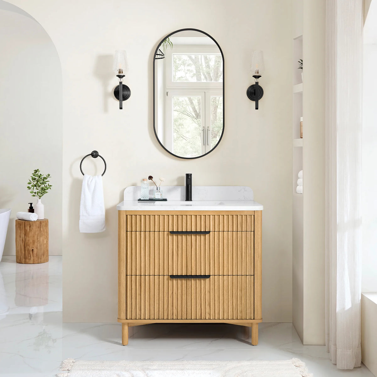 Bathroom scene for the 36-inch vanity and its matching mirror, with two black sconces and a towel ring, plus a log stool