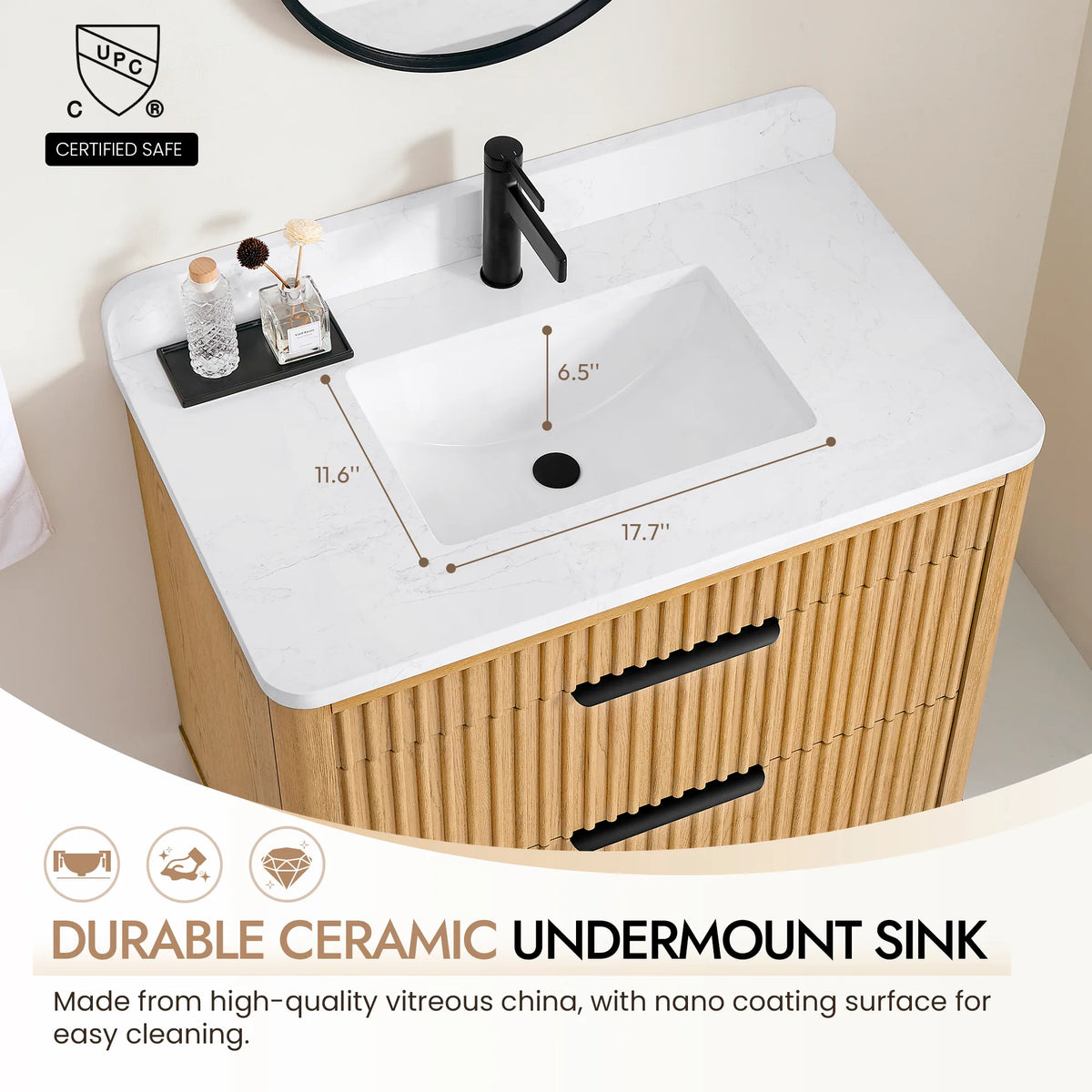 Callout on the ceramic undermount sink in the 36-inch vanity's veined top, with a black faucet above it