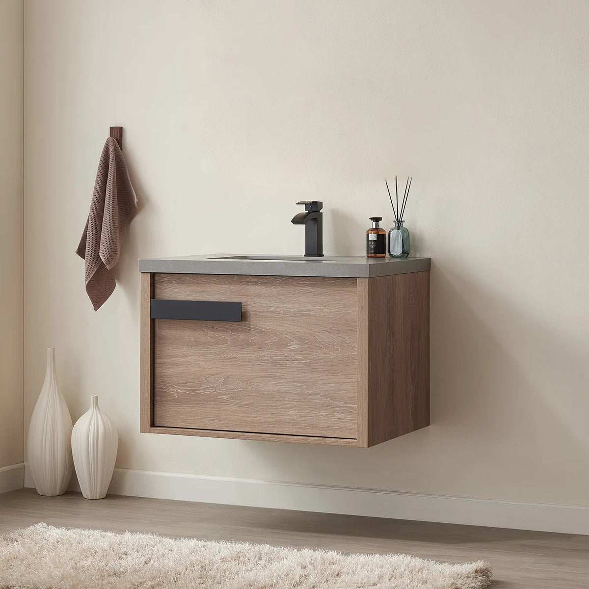 Angled view of the wall-hung cabinet, drawer front and grey stone edge