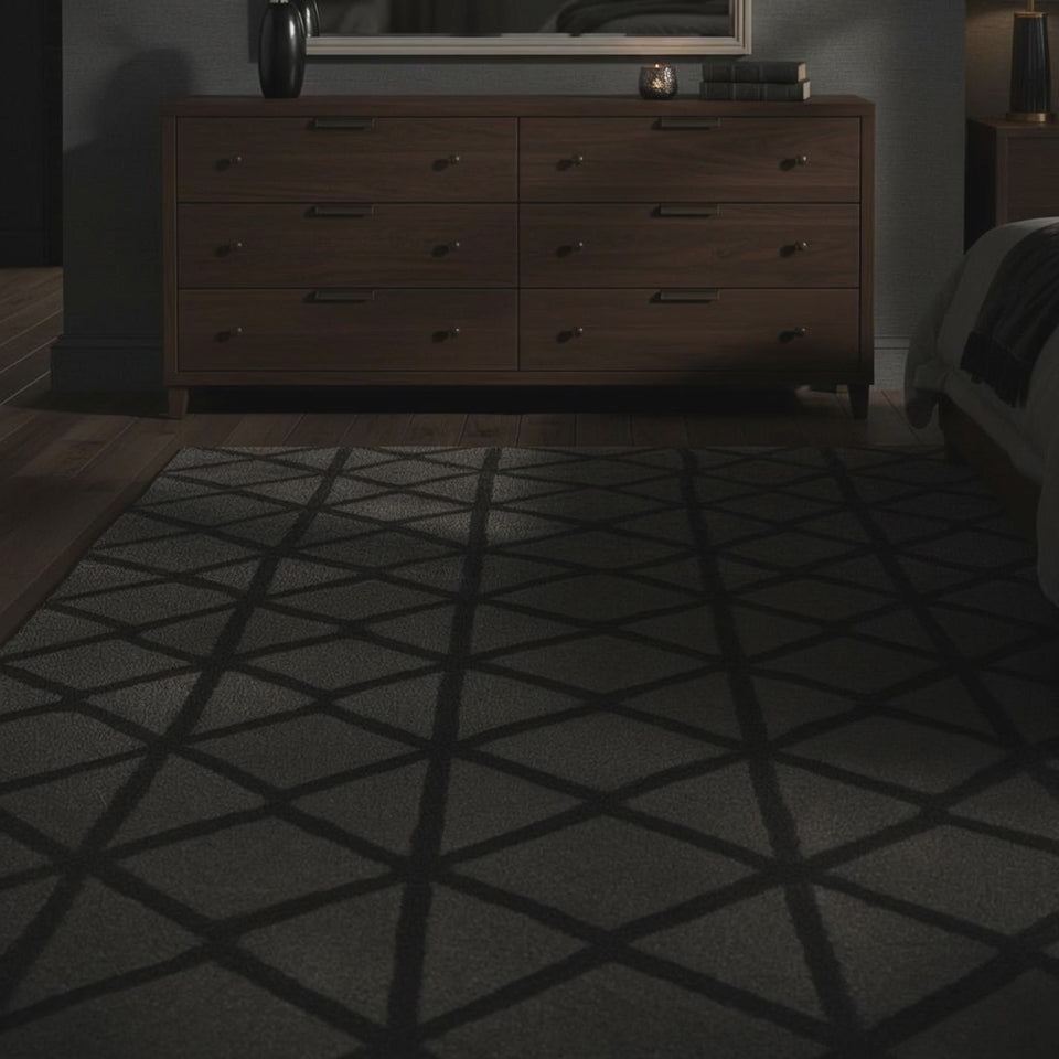 A short video of wooden dresser with a large mirror in a dimly lit room