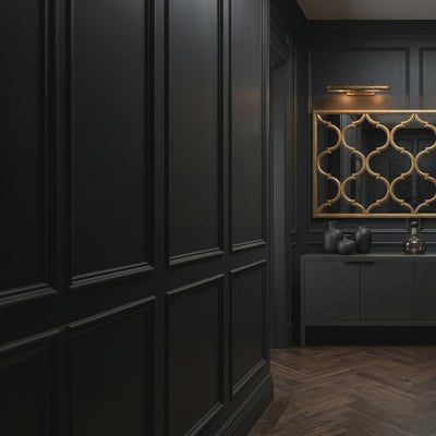 Short product video of Ambella Home Fret Mirror in antique wire brush gold, 81.5W x 2D x 40H oversized fretwork wall mirror above a dark credenza in a luxury hallway