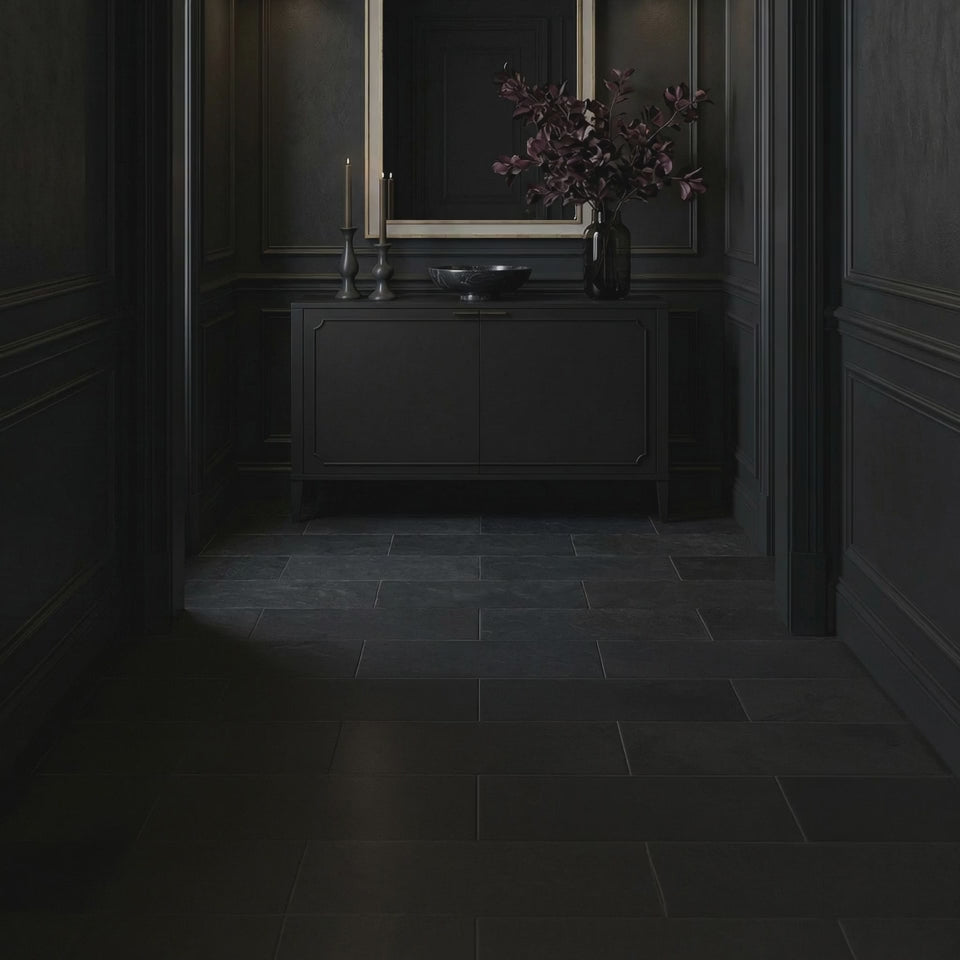 Short product video of the 26 Chateau Mirror - Antique Silver Leaf by Ambella Home, a tall decorative wall mirror with a circular crest and antique silver leaf finish styled above a dark entryway credenza
