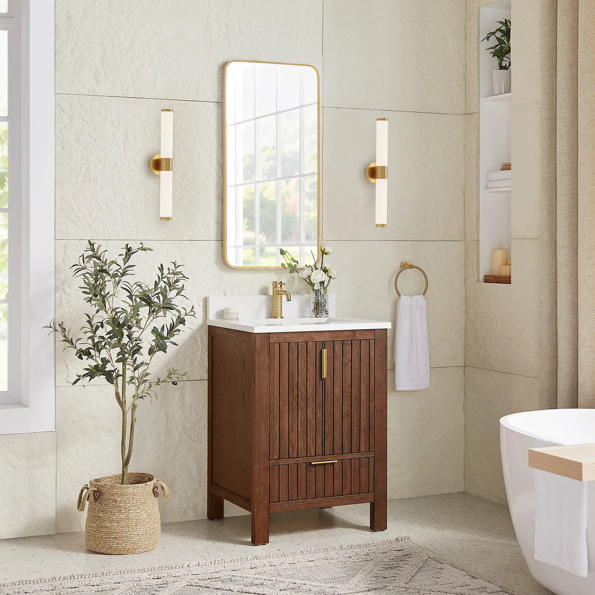Second angle: the 24-inch Aged Dark Brown Oak vanity with a matching gold mirror, sconces, a plant and a tub at right