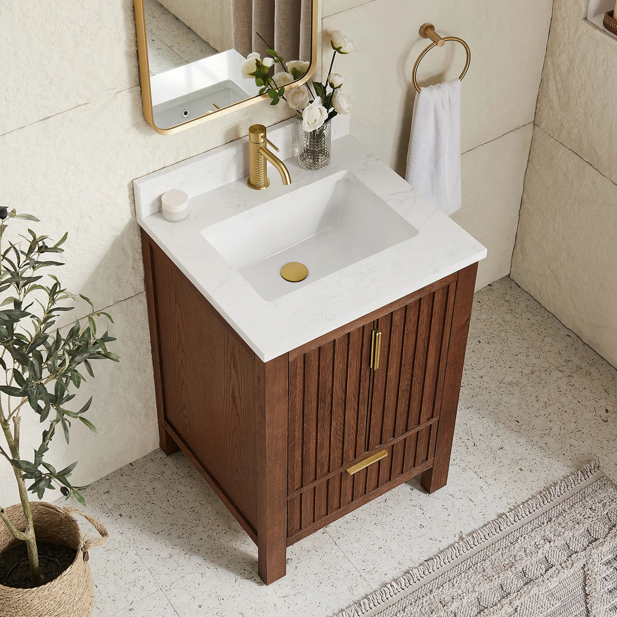 Countertop close view of a 24-inch Aged Dark Brown Oak vanity with a stone-composite top and ceramic undermount basin