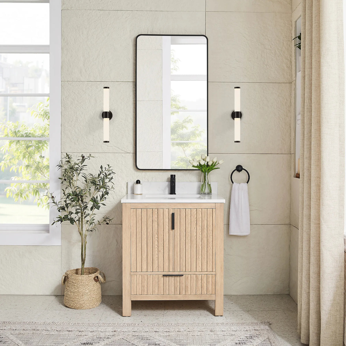 Staged room pairing a matching black mirror with the 30-inch vanity in Aged Natural Oak
