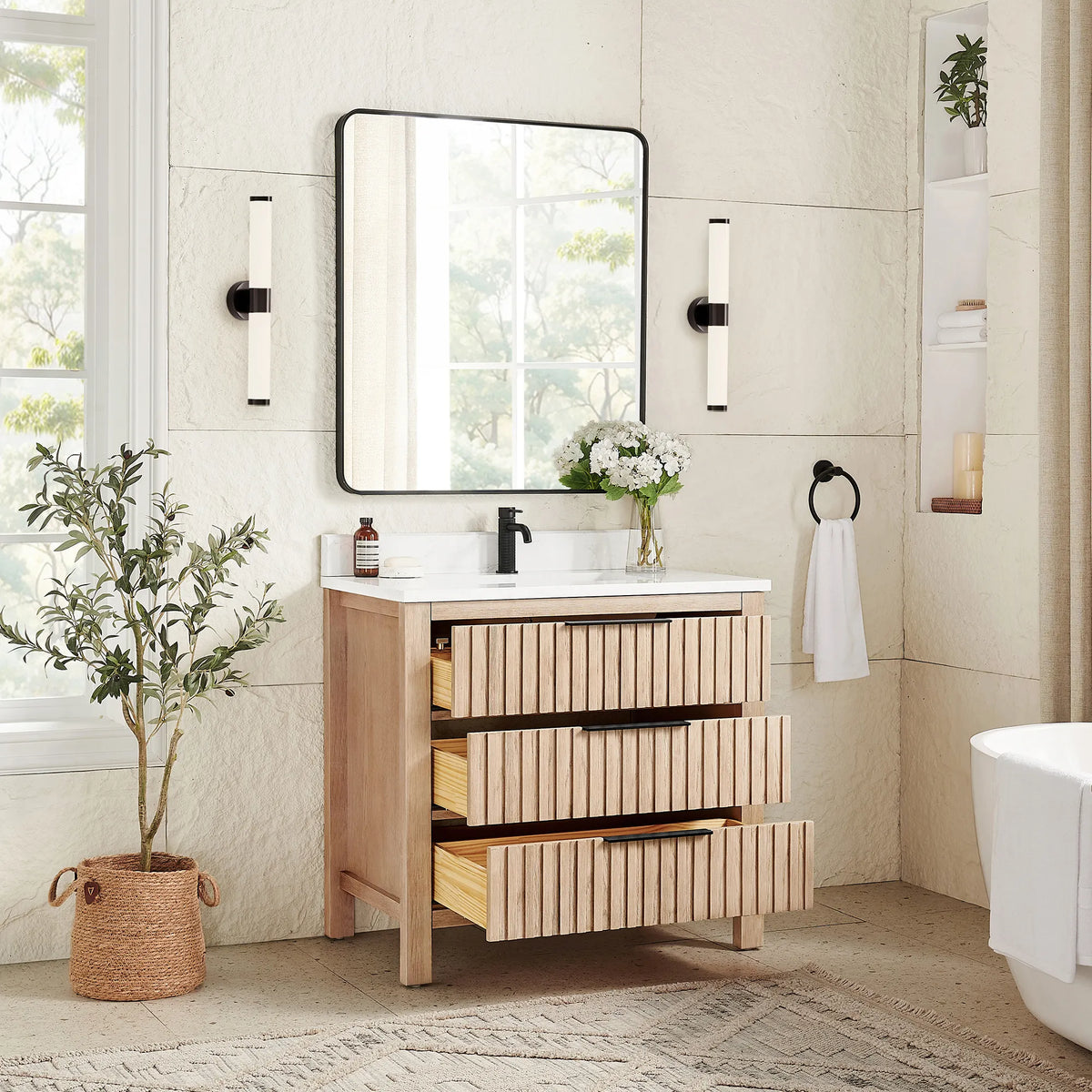 Storage on view in a staged room: 36-inch Aged Natural Oak cabinet with drawers pulled open