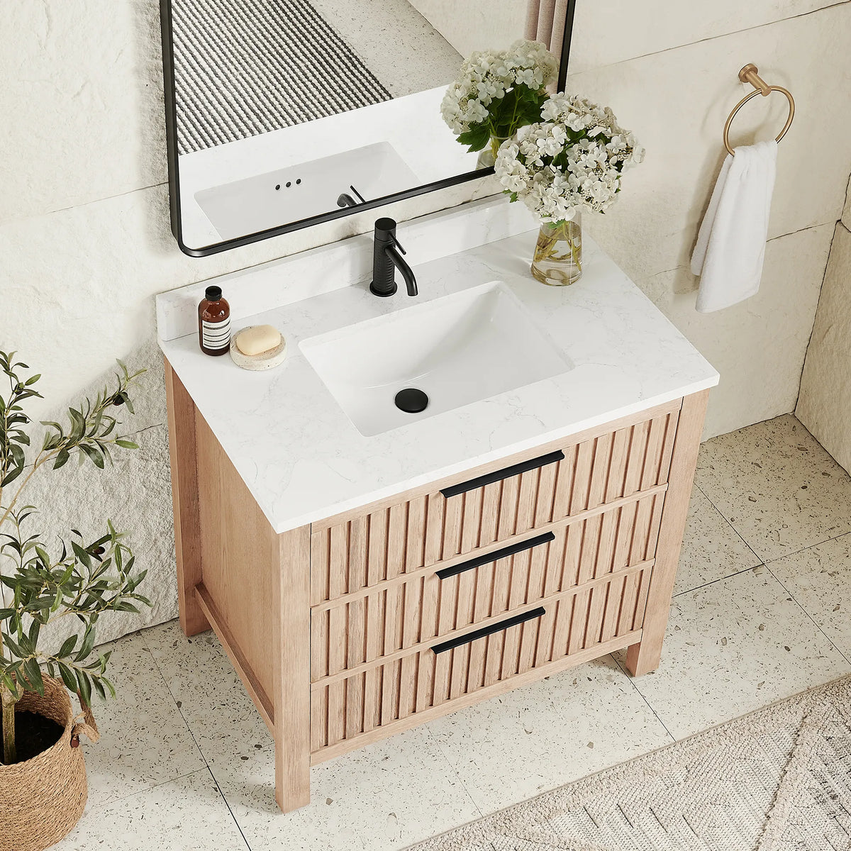 Countertop close view of a 36-inch Aged Natural Oak vanity with a stone-composite top and ceramic undermount basin