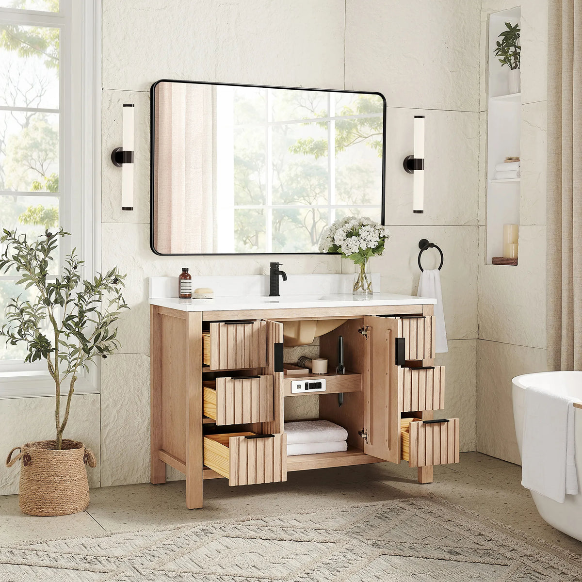 Storage on view in a staged room: 48-inch Aged Natural Oak cabinet with doors and drawers open