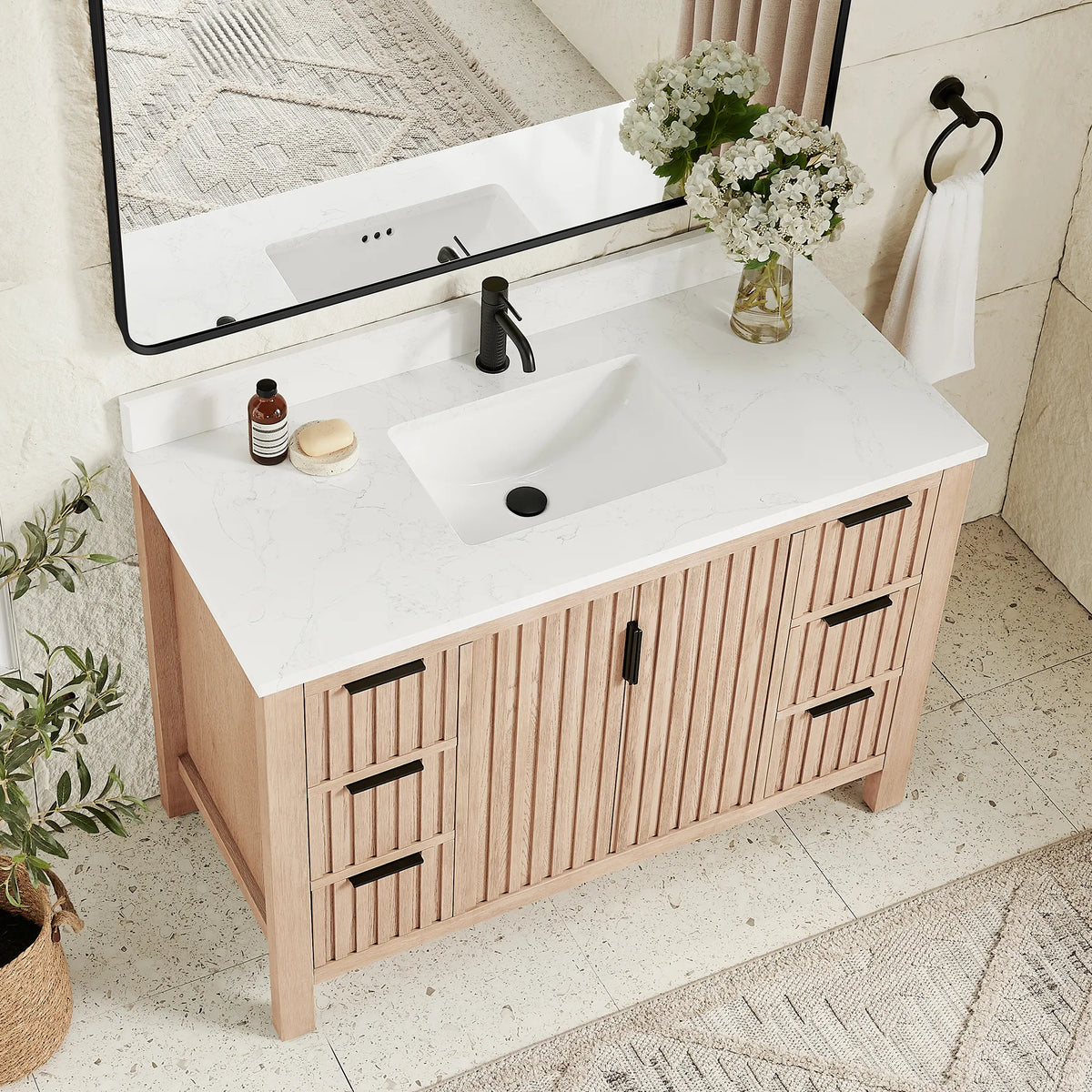 Countertop close view of a 48-inch Aged Natural Oak vanity with a stone-composite top and ceramic undermount basin