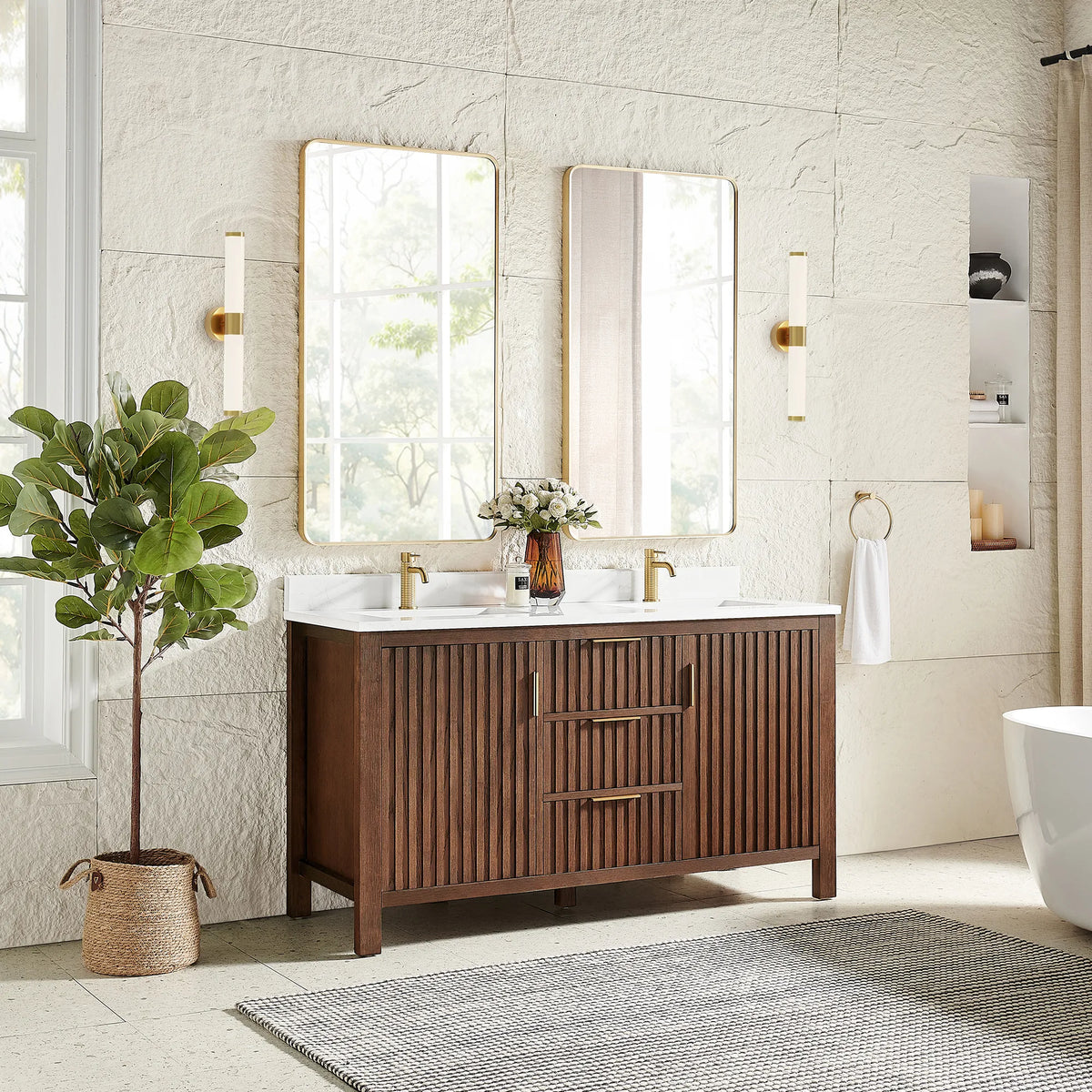 A plant and sconces frame the 60-inch Aged Dark Brown Oak vanity under two rectangular mirrors in gold frames