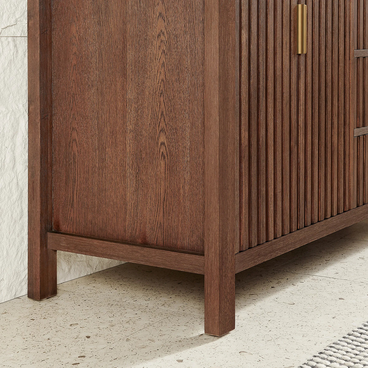 Base detail, 60-inch cabinet: corner leg and grooved side panel in Aged Dark Brown Oak