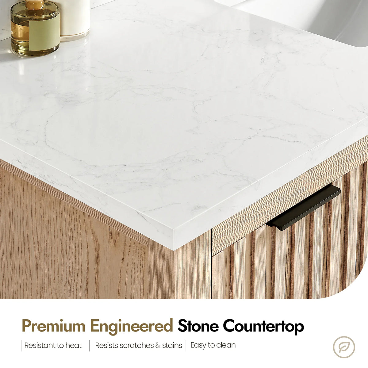 Close view of the white stone countertop edge on a 72-inch Aged Natural Oak cabinet, with surface-care notes
