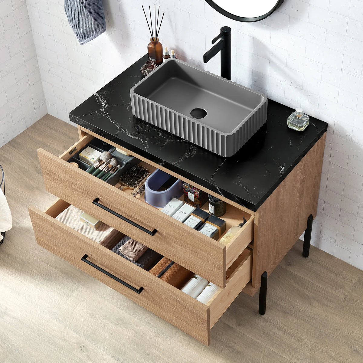 Angled shot, drawers open: bottles and brushes sorted in trays