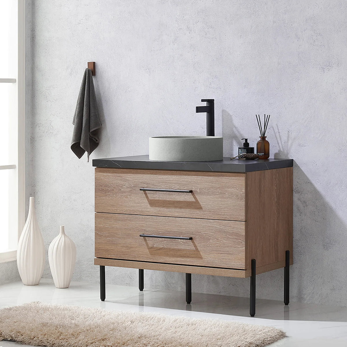 Side-on bathroom shot: drawer fronts and slim black legs in profile