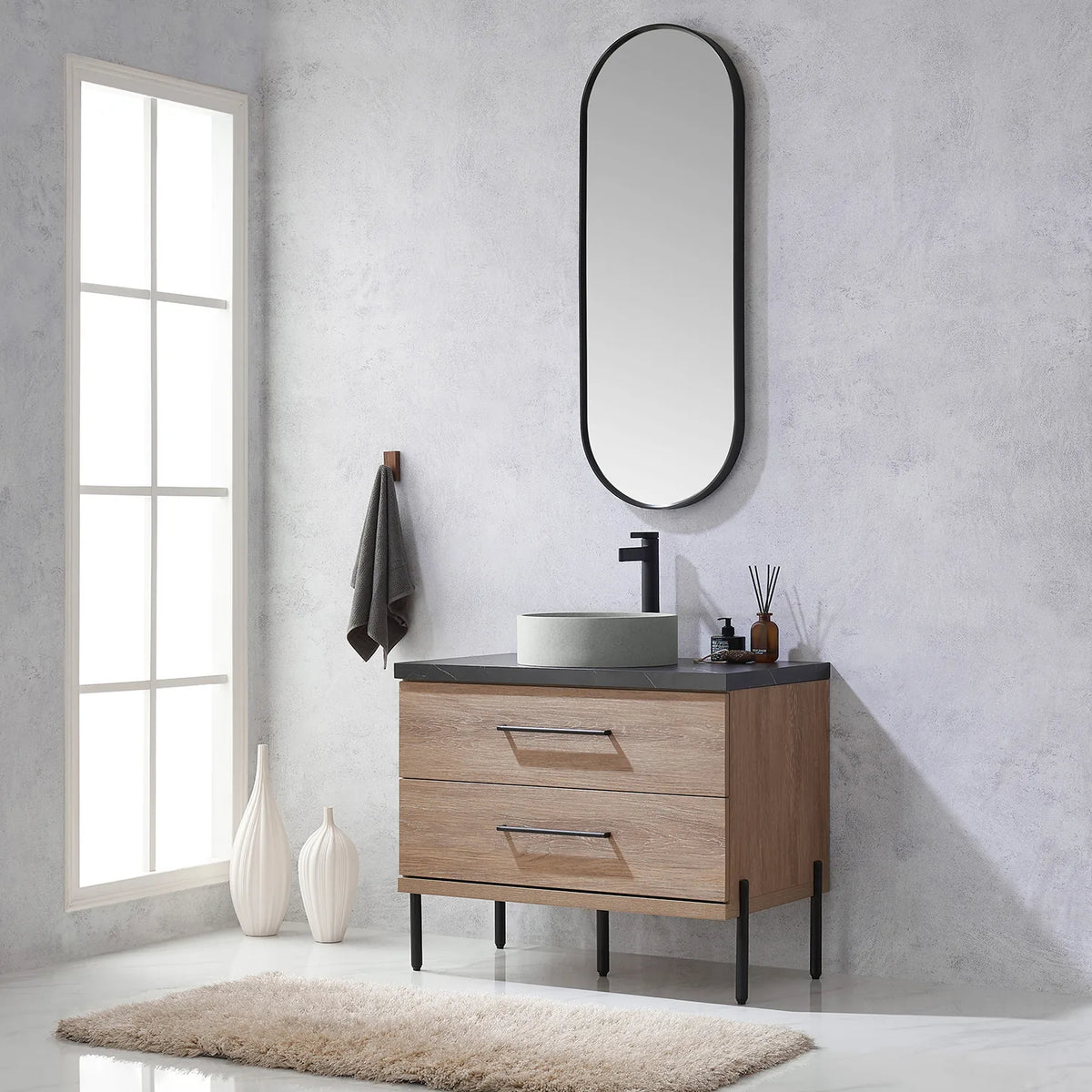 Plush rug, tall window and oval mirror above the oak vanity
