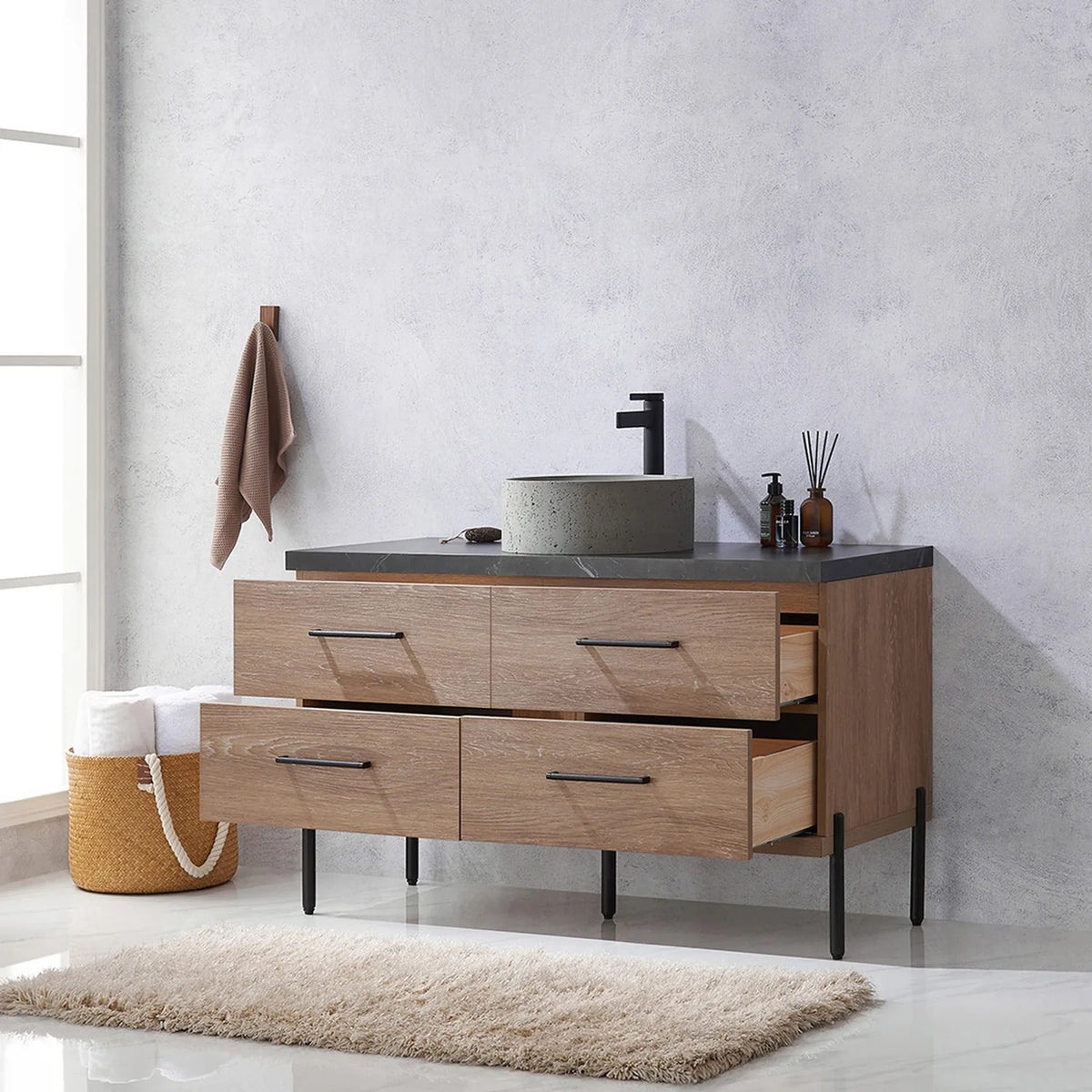 Pulled-out drawers with their contents on display in a styled bathroom