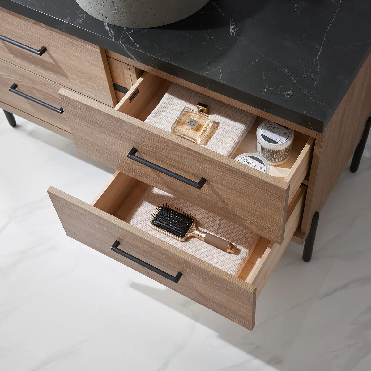 Fully open storage drawers with their contents arranged by type