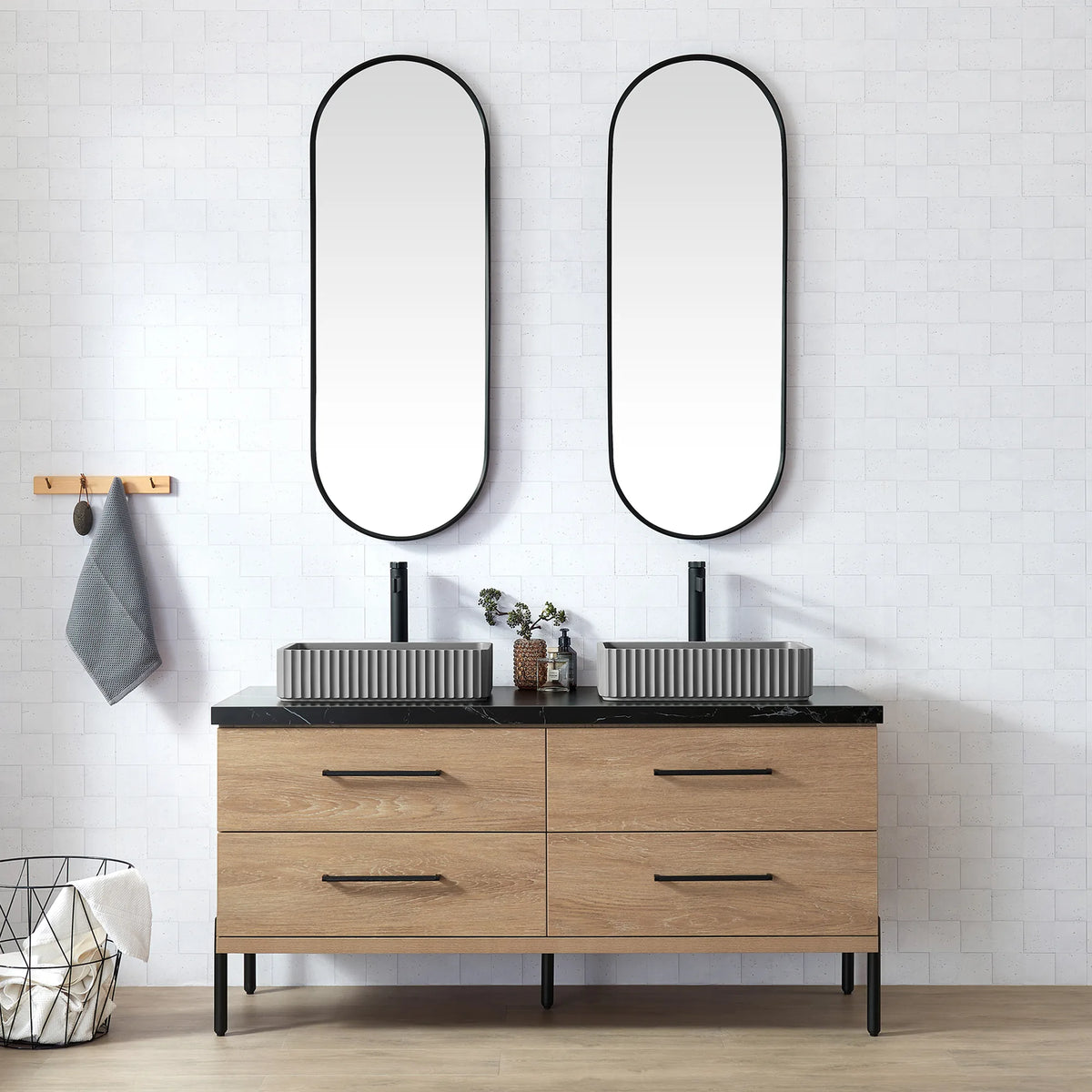 White brick-tile bathroom with oval mirrors and the oak vanity