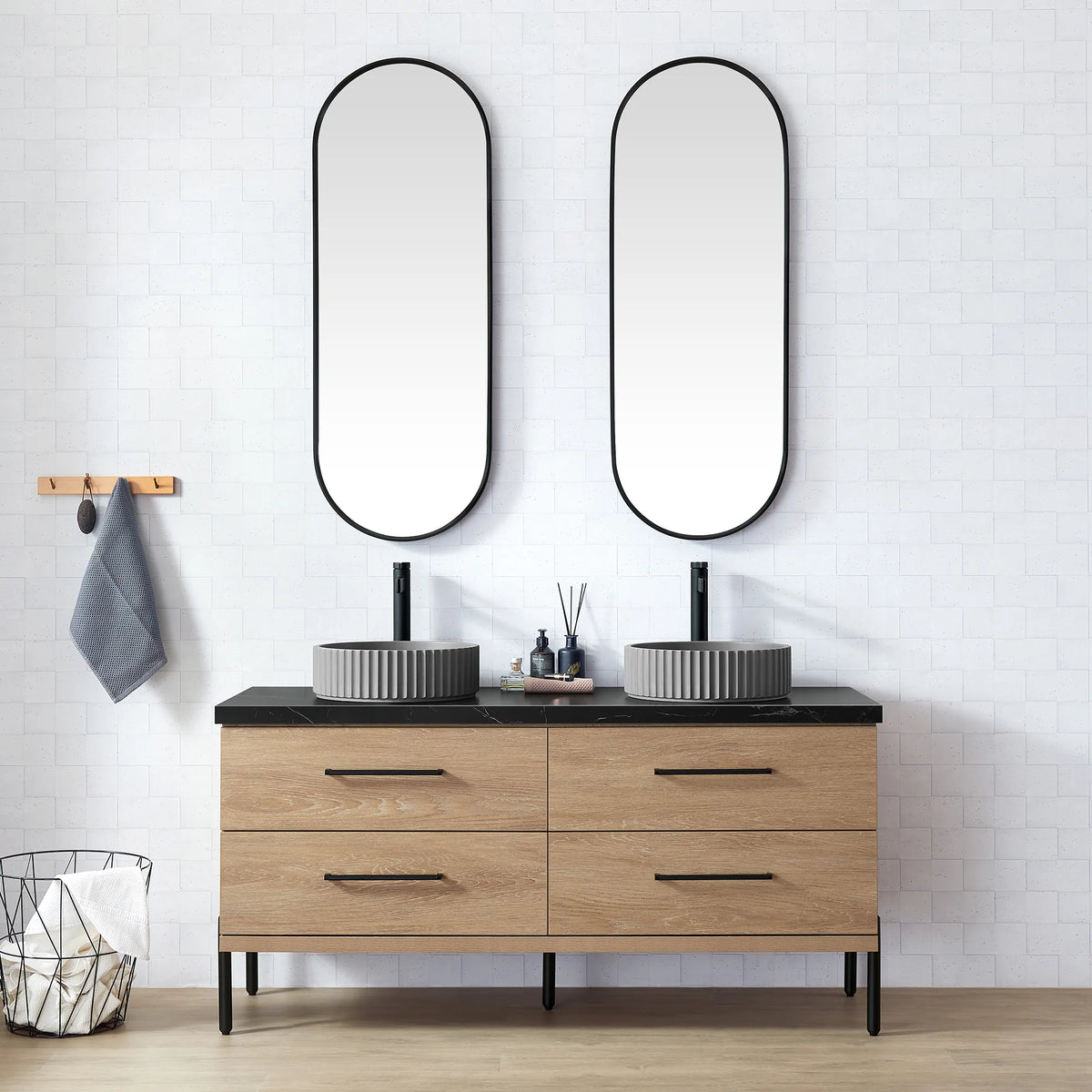 White brick-tile bathroom with oval mirrors and the oak vanity